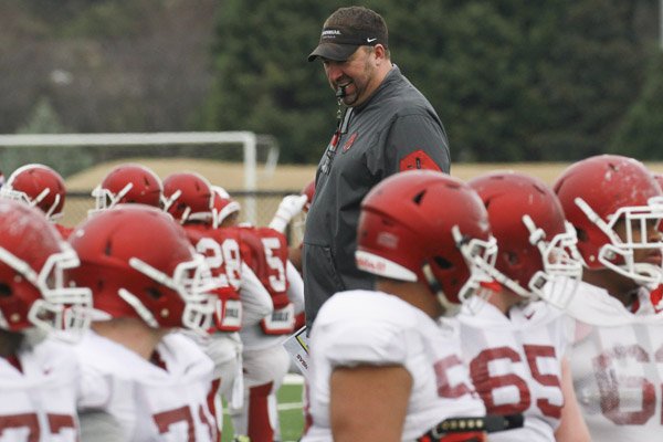 Arkansas coach Brett Bielema instructs his team during a practice Tuesday, Dec. 29, 2015, at Rhodes College in Memphis in preparation for the Liberty Bowl.