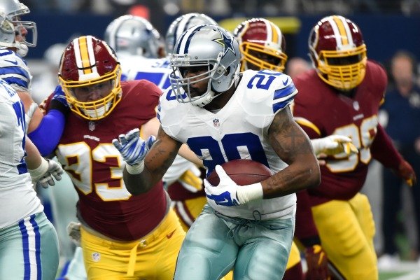 Dallas Cowboys running back Darren McFadden (20) runs the ball as Washington Redskins outside linebacker Trent Murphy (93) pursues in the first half of an NFL football game, Sunday, Jan. 3, 2016, in Arlington, Texas. (AP Photo/Michael Ainsworth)