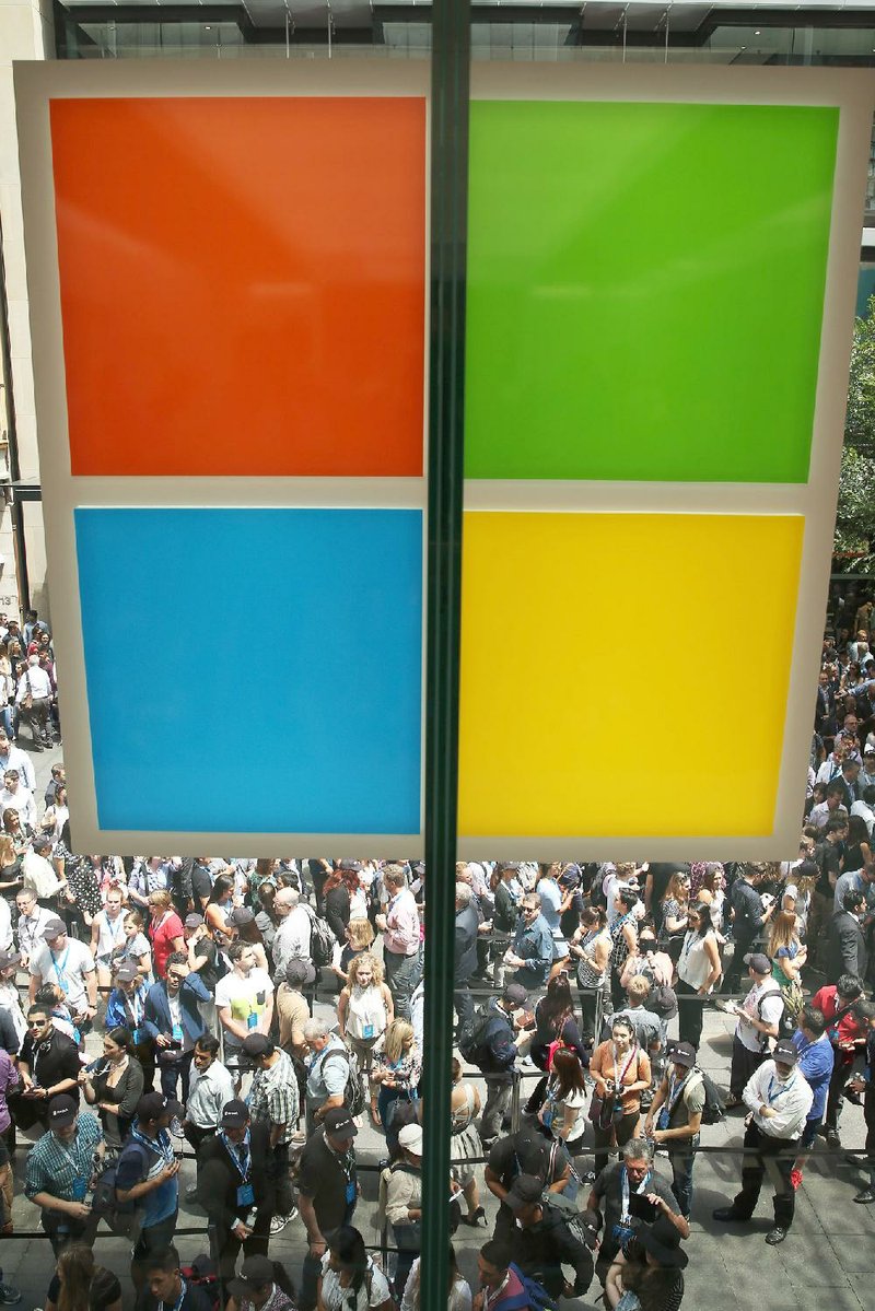 The Microsoft Corp. logo is displayed in the window of the company’s store in Sydney. The software company has built a network of subsidiaries designed to minimize the taxes it pays to governments worldwide.