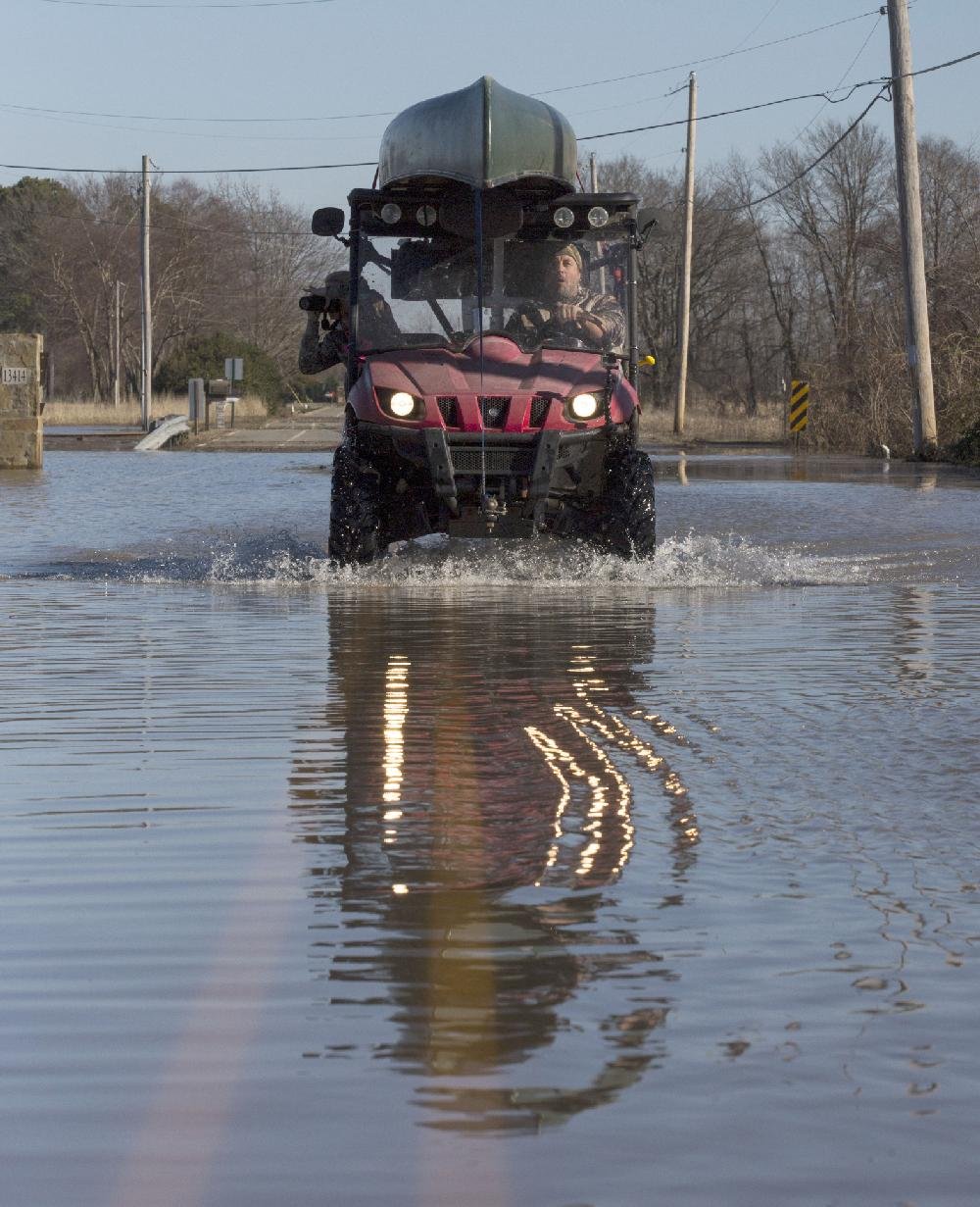 Flood crest heads downriver
