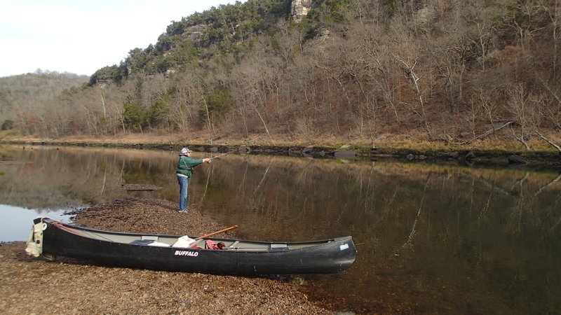 Fishing and floating are an ideal combination at the White River below Beaver Dam. Russ Tonkinson fishes for trout during a break while canoeing from the dam to Houseman Access, a trip of about 7 miles.