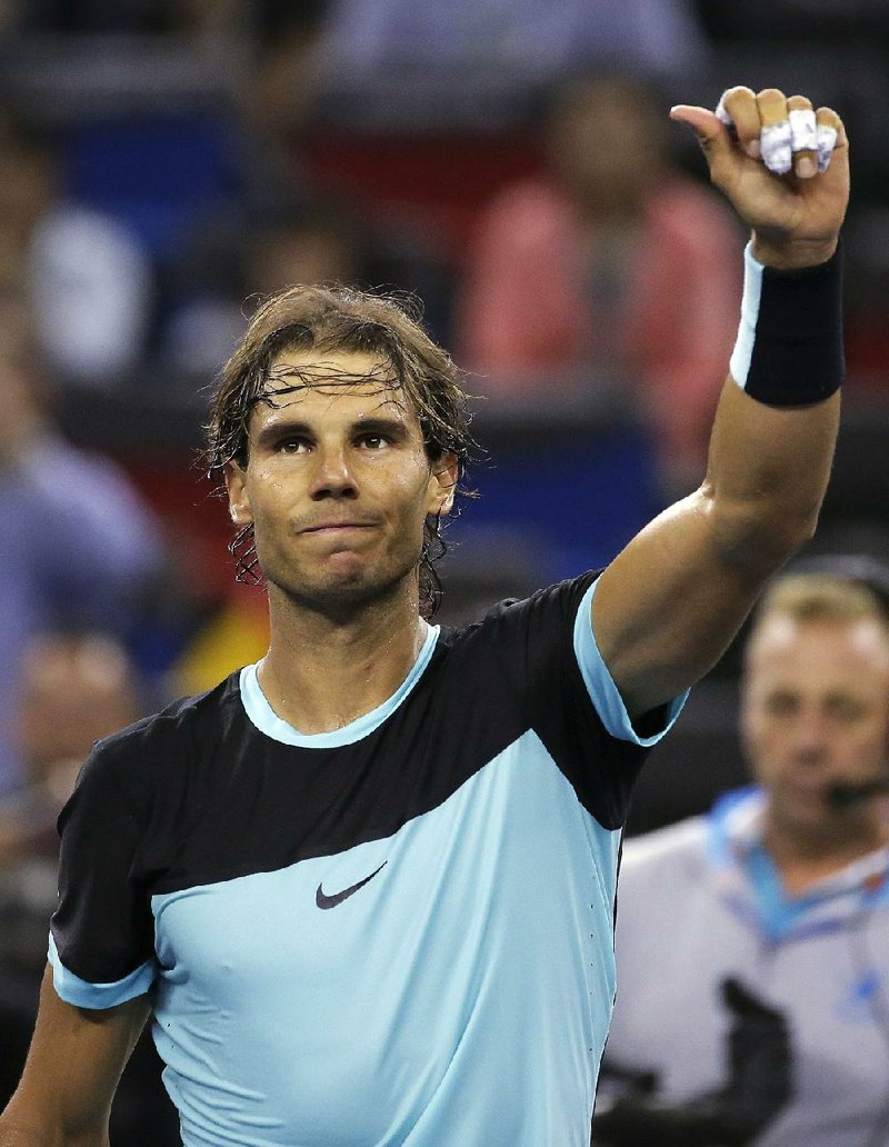 Rafael Nadal of Spain celebrates after defeating Stan Wawrinka of Switzerland in the quarterfinal match of the Shanghai Masters tennis tournament in Shanghai, China, Friday, Oct. 16, 2015.
