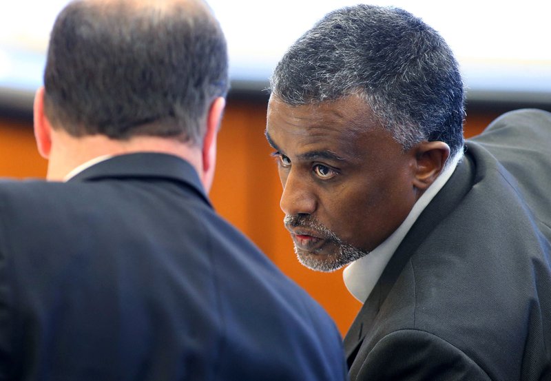 In this Dec. 29, 2015 file photo, Fanuel Gebreyes, right, father of Aden Hailu, talks to his attorney David O'Mara during a hearing in Washoe County District Court in Reno, Nev. Hailu, a 20-year-old woman at the center of an end-of-life court battle over her treatment at a Reno hospital, died Monday, Jan. 4, 2016, while still on life support, her family's lawyer said Tuesday.