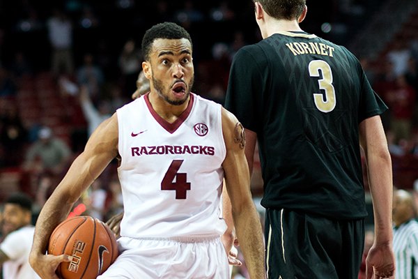 Arkansas' Jabril Durham (4) reacts to the crowd after a turnover in the final seconds of the game to give Arkansas possession of the ball in the second half of an NCAA college basketball game against Vanderbilt in Fayetteville, Ark., Tuesday, Jan. 5, 2016. Arkansas won 90-85 in overtime. (AP Photo/Sarah Bentham)
