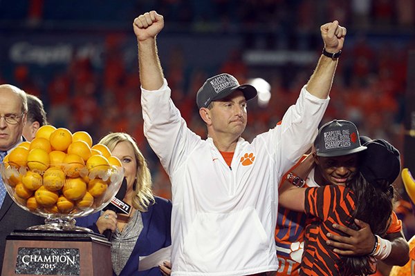Clemson head coach Dabo Swinney raises his arms after winning the Orange Bowl NCAA college football semifinal playoff game against Oklahoma, Thursday, Dec. 31, 2015, in Miami Gardens, Fla. Clemson defeated Oklahoma 37-17 to advance to the championship game. (AP Photo/Lynne Sladky)

