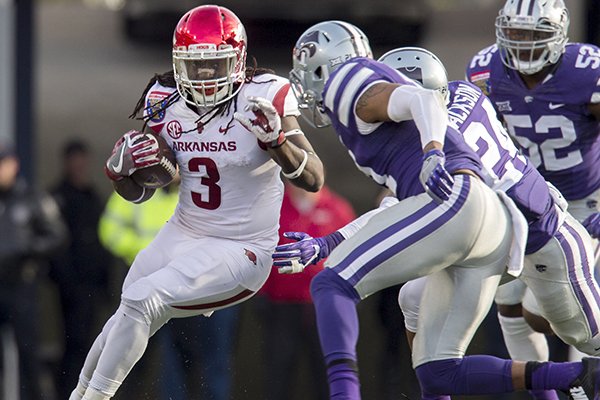 Arkansas running back Alex Collins (3) carries the ball during the first quarter on Saturday, Jan. 2, 2016, at the Liberty Bowl in Memphis, Tenn.