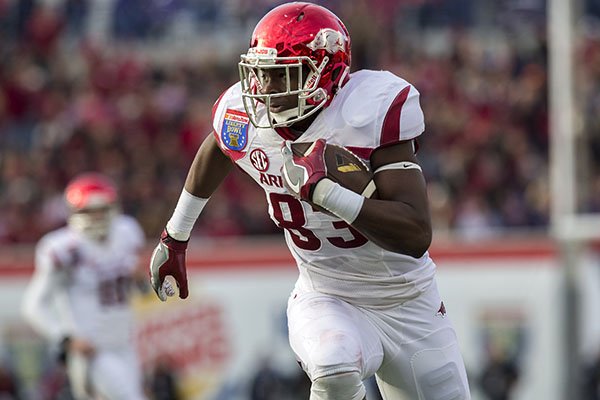 Arkansas tight end Jeremy Sprinkle (83) runs with the ball following a reception during the second quarter on Saturday, Jan. 2, 2016, at the Liberty Bowl in Memphis, Tenn.