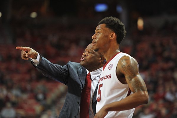 Arkansas coach Mike Anderson instructs senior guard Anthlon Bell during a game against Vanderbilt on Tuesday, Jan. 5, 2016, at Bud Walton Arena in Fayetteville. 