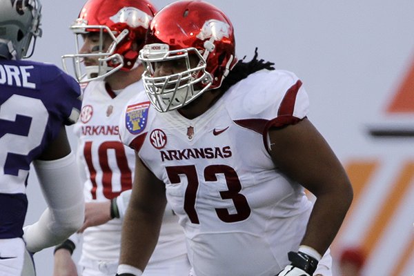 Arkansas offensive lineman Sebastian Tretola (73) plays against Kansas State in the first half of the Liberty Bowl NCAA college football game Saturday, Jan. 2, 2016, in Memphis, Tenn. (AP Photo/Mark Humphrey)
