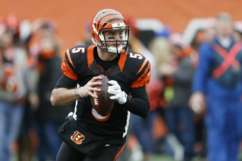 In this Sunday, Jan. 3, 2016 file photo, Cincinnati Bengals quarterback AJ McCarron looks to pass in the first half of an NFL football game against the Baltimore Ravens in Cincinnati.