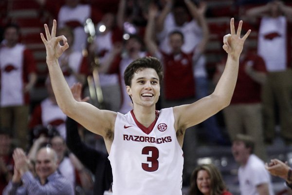 Arkansas' Dusty Hannahs (3) holds up his hands after sinking a three-pointer during the second half of an NCAA college basketball game against Mississippi State, Saturday, Jan. 9, 2016, in Fayetteville, Ark. Arkansas beat Mississippi State, 82-68. (AP Photo/Samantha Baker)