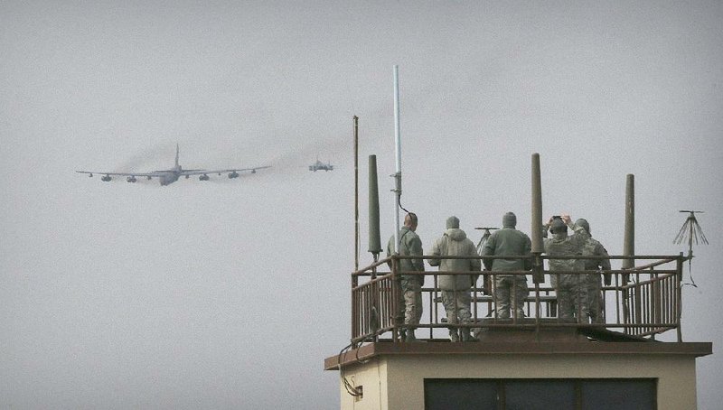 A U.S. Air Force B-52 bomber flies over Osan Air Base in Pyeongtaek, South Korea, on Sunday.