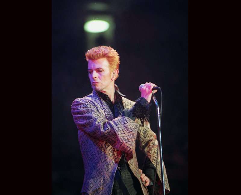 David Bowie performs during a concert celebrating his 50th birthday, at Madison Square Garden in New York. Bowie, the innovative and iconic singer whose illustrious career lasted five decades, died Monday, Jan. 11, 2016, after battling cancer for 18 months. He was 69.