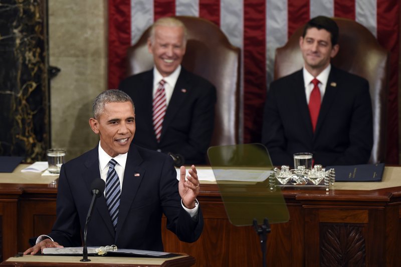 Vice President Joe Biden and House Speaker Paul Ryan of Wis., listen as President Barack Obama gives his State of the Union address to a joint session of Congress on Capitol Hill in Washington, Tuesday, Jan. 12, 2016. (AP Photo/Susan Walsh)
