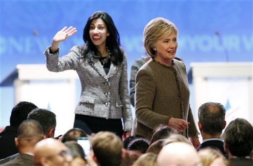 Hillary Clinton, right, greets supporters alongside longtime aide Huma Abedin, left, after a Democratic presidential primary debate Saturday, Dec. 19, 2015, at Saint Anselm College in Manchester, N.H. 