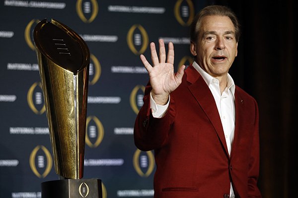 Alabama head coach Nick Saban poses with the championship trophy during a news conference for the NCAA college football playoff championship Tuesday, Jan. 12, 2016, in Scottsdale, Ariz. Alabama beat Clemson 45-40 to win the championship. (AP Photo/Morry Gash)
