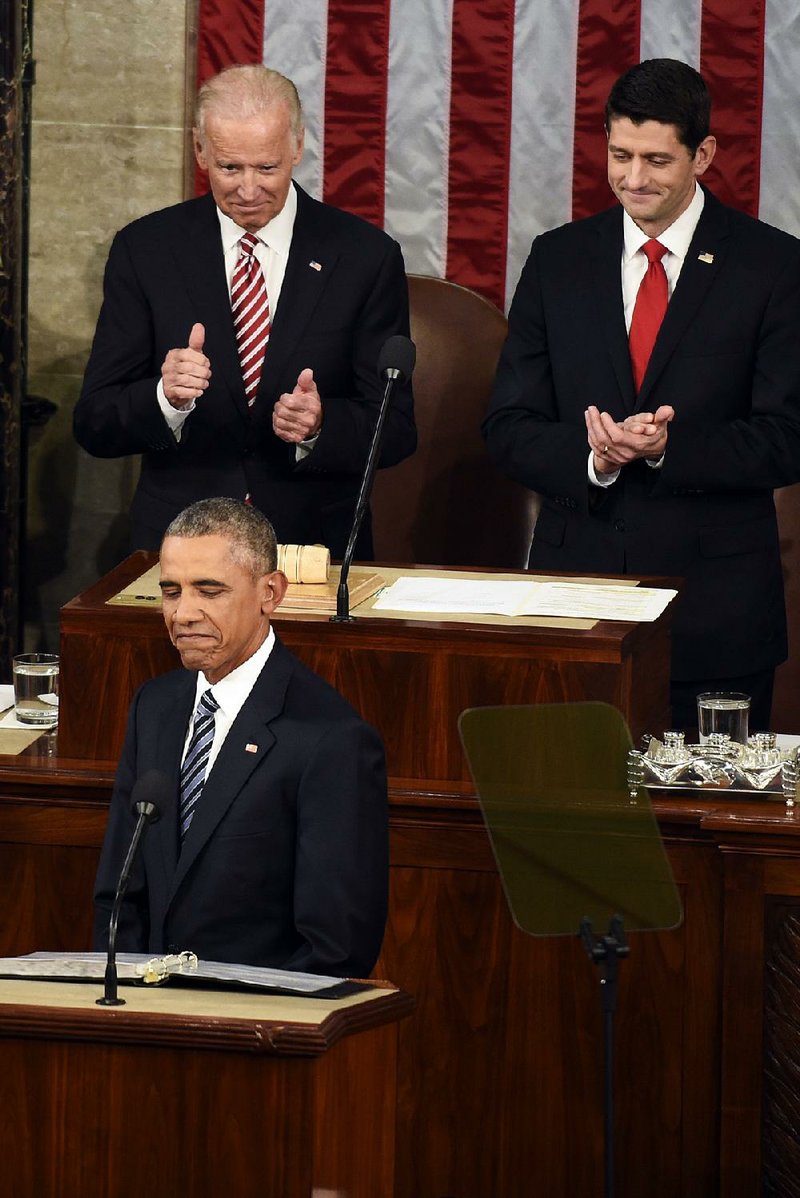 President Barack Obama pauses during his State of the Union address Tuesday night as Vice President Joe Biden (top left) and House Speaker Paul Ryan join in applauding his remarks. 