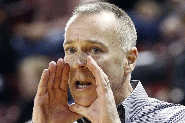 Arkansas head coach Jimmy Dykes calls to his players in the second half of an NCAA college basketball game in Starkville, Miss., Sunday, Jan. 10, 2016. No. 7 Mississippi State won 80-55. (AP Photo/Rogelio V. Solis)
