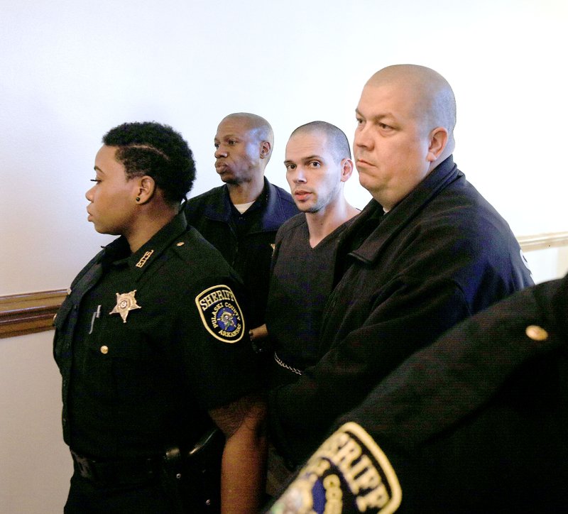 Arron Lewis (center) is led out of court Tuesday at the Pulaski County Courthouse after jury selection in his capital-murder trial. Nine women and three men were chosen for the jury. 