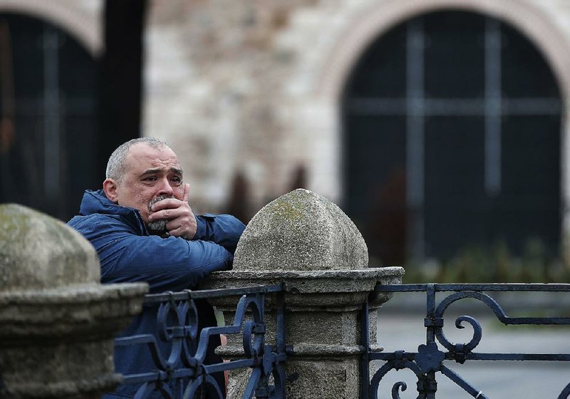 A bystander on Wednesday visits the site in Istanbul’s Sultanahmet tourist district where a bomb went off Tuesday.