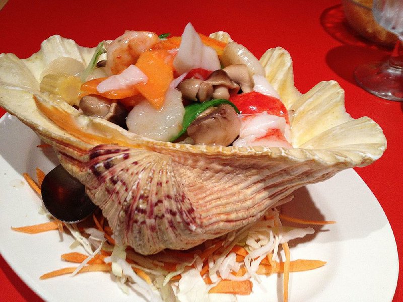 Fantastic China in the Heights serves up its chef’s specialty Seafood Combination in a huge shell. 
