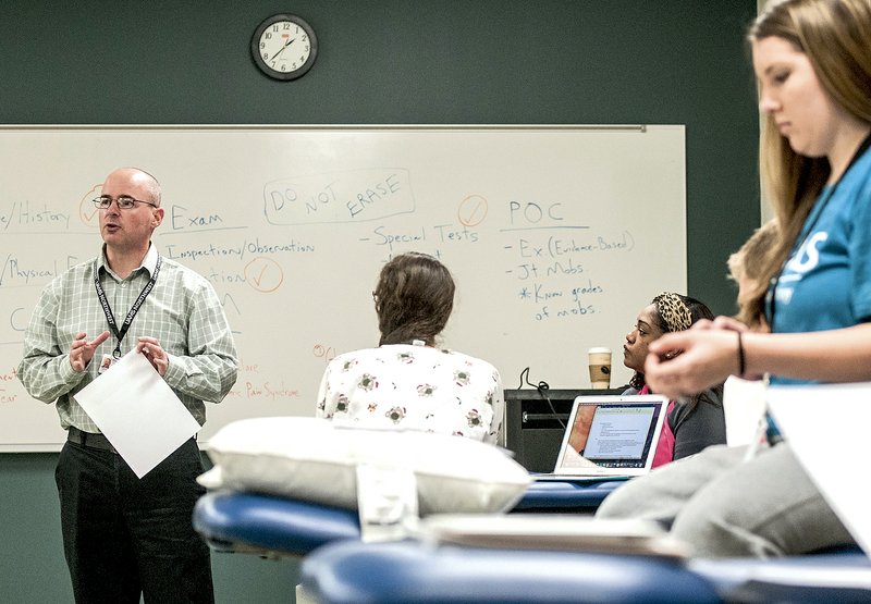 The UAMS program in Fayetteville provides unique opportunities for students studying to become physical therapists. Many of the teachers' lectures are recorded online, with students watching on their own time. Then, most of the students' days are spent in lab settings, where they can put their earning to practice.