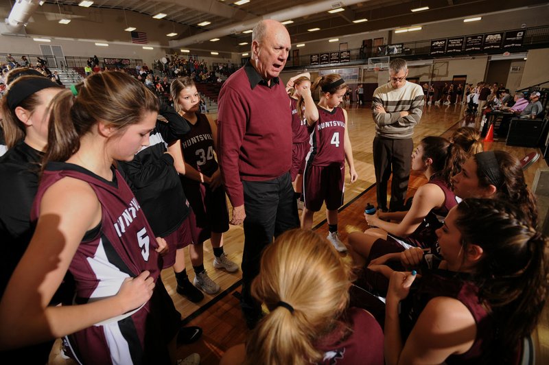 Charles Berry, longtime Huntsville girls basketball coach, directs his team Jan. 8 from the bench during the Lady Eagles' win over Lincoln in Lincoln.