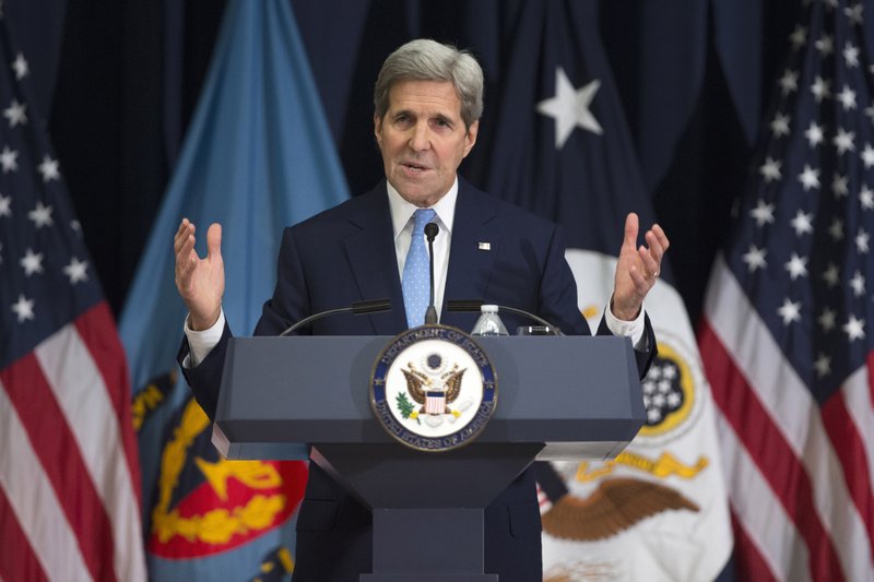 Secretary of State John Kerry gestures Wednesday while giving a foreign policy speech at National Defense University in Washington. The Obama administration is planning to expand a program to let would-be migrants from Central America apply for refugee status before they attempt to come to the U.S., Kerry said. 