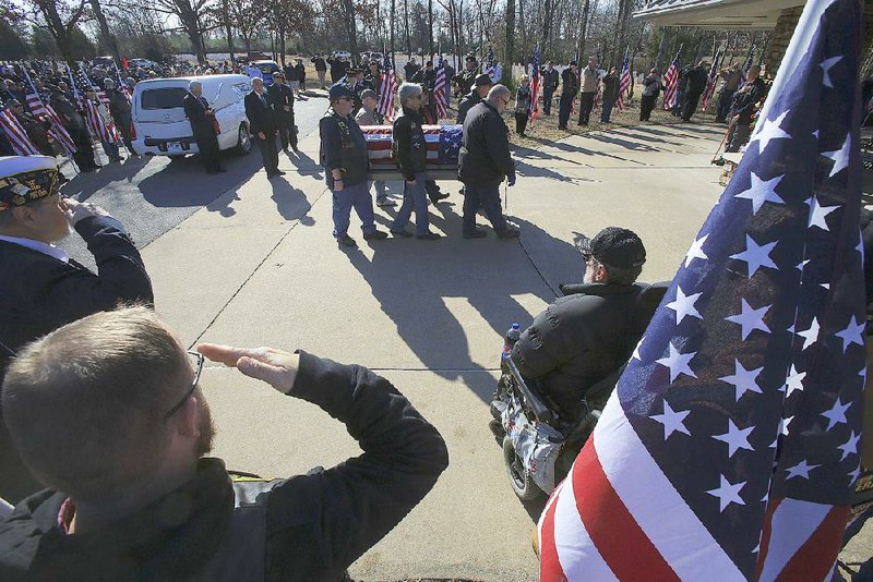 Veterans salute Thursday as the coffin of indigent veteran Freddie Lee Hillhouse is carried in for a funeral service at the State Veterans Cemetery in North Little Rock.