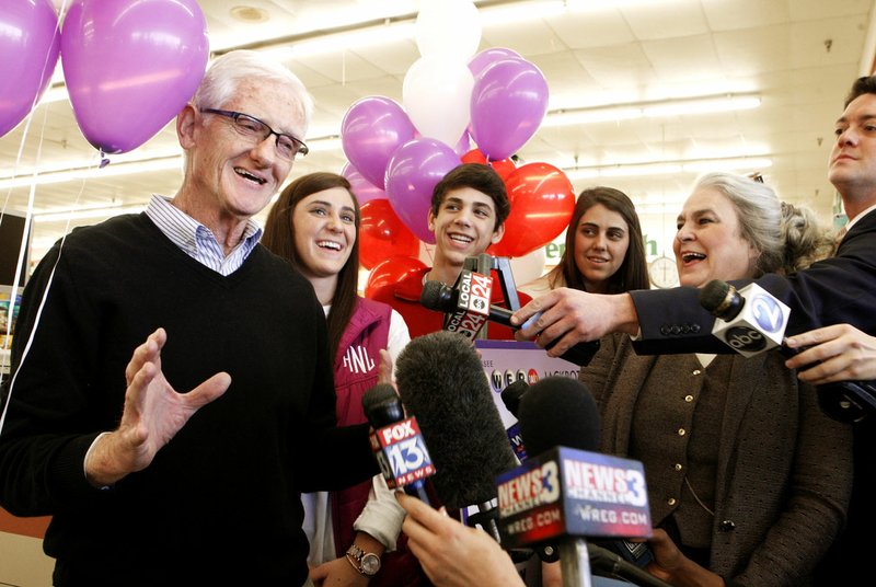 Dwane Cole (left), mayor of Munford, Tenn., speaks Thursday in Naifeh’s Grocery in Munford, Tenn. One of the winning Powerball tickets in Wednesday’s record jackpot drawing of $1.6 billion was sold at the store.