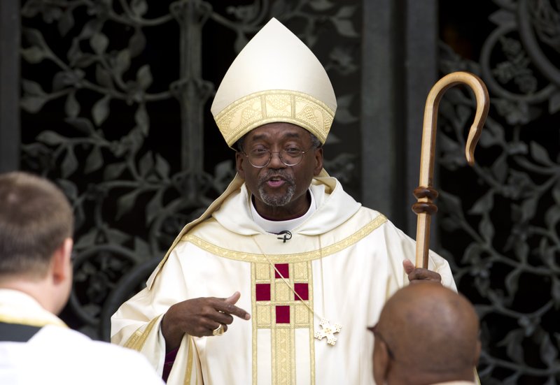 Episcopal Church Presiding Bishop-elect Michael Curry speaks to churchgoers as he arrives at the Washington National Cathedral in Washington. On Thursday, Jan. 14, 2016, Anglican leaders temporarily restricted the role of the U.S. Episcopal Church in their global fellowship as a sanction over the American church's acceptance of gay marriage. 