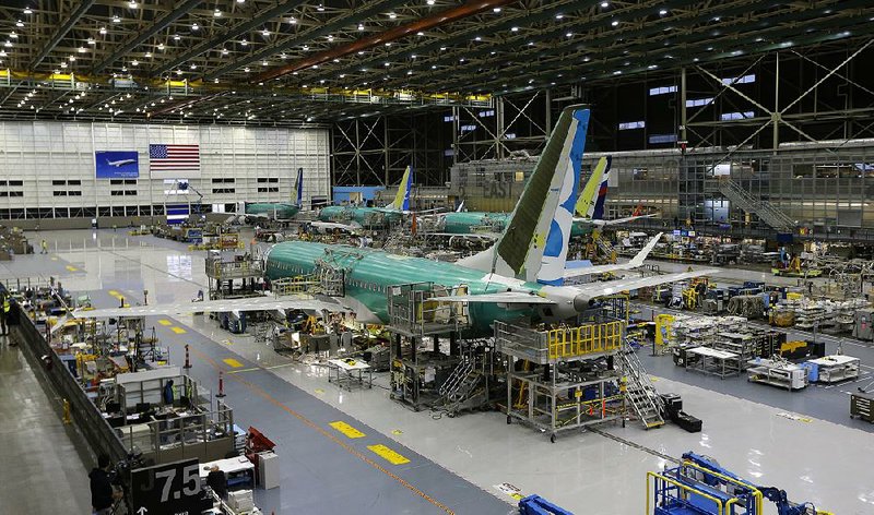 A Boeing 737 MAX sits on the assembly line at Boeing’s production building in Renton, Wash., in December. U.S. industrial production dropped for the third-straight month in December.