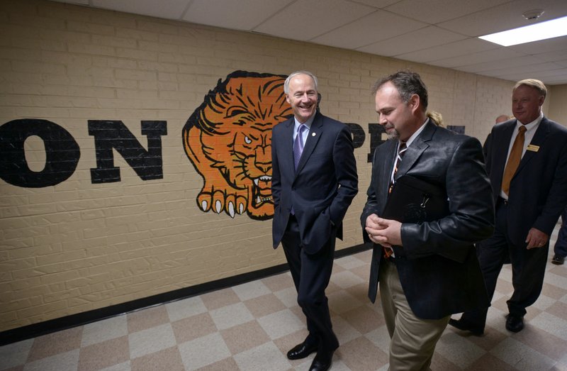 Gov. Asa Hutchinson (left) takes a tour Friday with principal Zane Vanderpool at Glenn Duffy Elementary School in Gravette. The School District hosted the governor, originally from Gravette, and first lady for a “Welcome Home Celebration” with stops at the high school, middle school and elementary school.