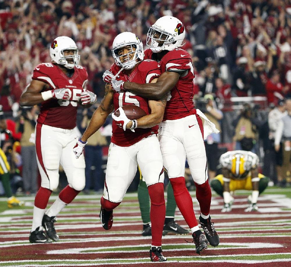 Jeff Janis holds up ball after Hail Mary catch, AP photo