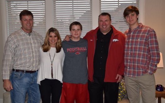 Tight end Grayson Gunter and family pose with Coach Bret Bielema. 