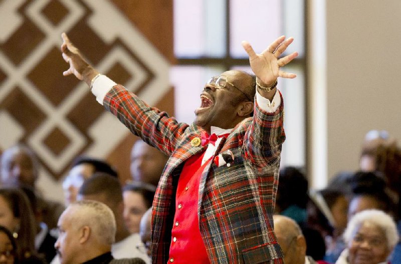 Cal Murrell, otherwise known as “The Happy Preacher,” shouts Monday during the Rev. Martin Luther King Jr. commemorative service at Ebenezer Baptist Church where King preached in Atlanta.