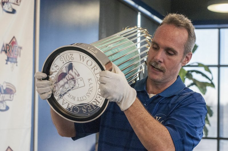 NWA Democrat-Gazette/ANTHONY REYES &#x2022; @NWATONYR Curt Nelson, Director of the Royals Hall of Fame, shows the bottom of the World Series trophy as he puts it away Monday, Jan. 18, 2016 at Arvest Ballpark in Springdale. The trophy was on display so fans could take their picute with it. Christian Colon Kansas City Royals infielder, was also on had to sign autographs. Colon the go ahead run in the World Series against the New York Mets.