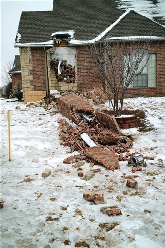 In this Dec. 29, 2015 photo, remains of a collapsed chimney rest on the ground outside a home in Edmond, Okla., following an earthquake. In Oklahoma the stronger and more frequent earthquakes have people worrying about the big one. In Oklahoma, now the countrys earthquake capital, people are talking nervously about the big one as man-made quakes get stronger, more frequent and closer to major population centers. 