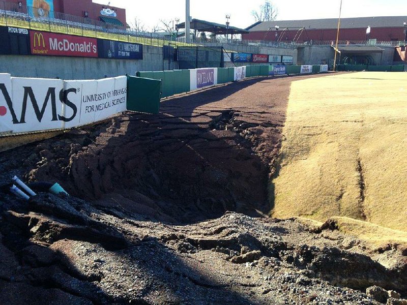 This sinkhole in the outfield of the city-owned Dickey Stephens Park in North Little Rock is estimated to be 35 feet in diameter. Such holes have been blamed on problems with the baseball field’s drainage system. 