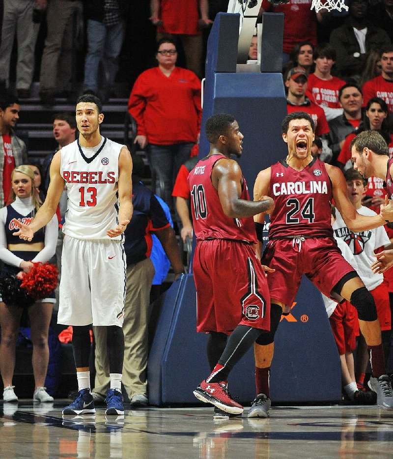 Mississippi forward Anthony Perez (13) reacts after being called for a charging foul against South Carolina forward Michael Carrera (24) during overtime of an NCAA college basketball game in Oxford, Miss., Tuesday, Jan. 19, 2016. 