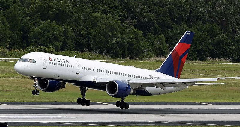 A Delta Air Lines Boeing 757-232 lands at Tampa International Airport in Tampa, Fla., in this file photo. The airline on Tuesday reported 2015 revenue of $40.7 billion.