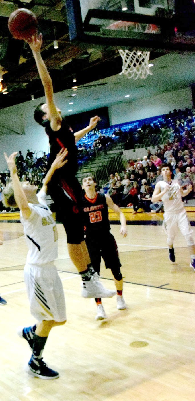 Photo by Mike Eckels During the Gravette-Shiloh Christian senior boys&#8217; game in Springdale Jan. 15, Chris Childress (Lions #4) tries for a layup.