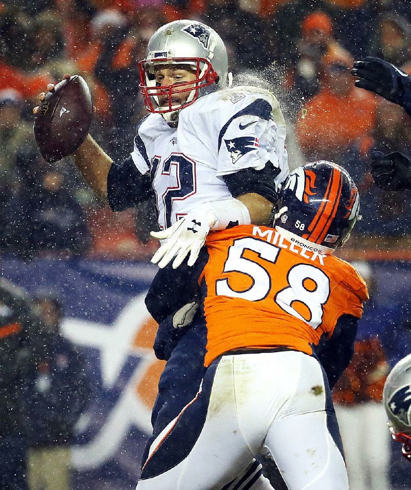 Denver Broncos linebacker Von Miller (58) sacks New England Patriots quarterback Tom Brady on Nov. 29. Miller and Broncos cornerback Chris Harris Jr. were both hurt and unavailable for the 2014 AFC Championship Game against the Patriots.