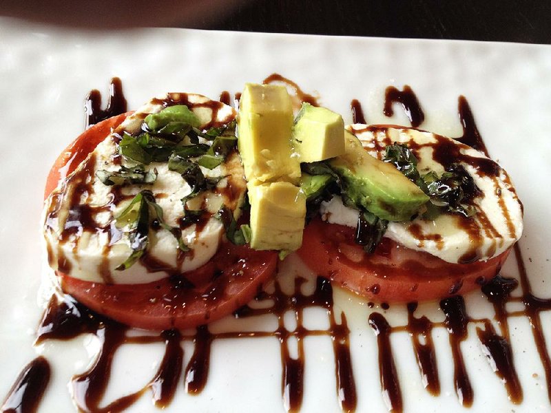 Caprese at Cache, also on the appetizer menu for lunch, adds avocado to fresh mozzarella, tomato and basil. 