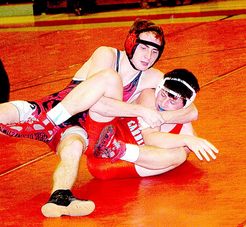 Photo by Rick Peck McDonald County&#8217;s Truman Craig wraps ups Webb City&#8217;s Carson Cornell on his way to a pin in the 145-pound weight class at a triangular held Jan. 14 at MCHS. McDonald County beat Webb City 42-30 and lost to Neosho 59-12 in its two duals.