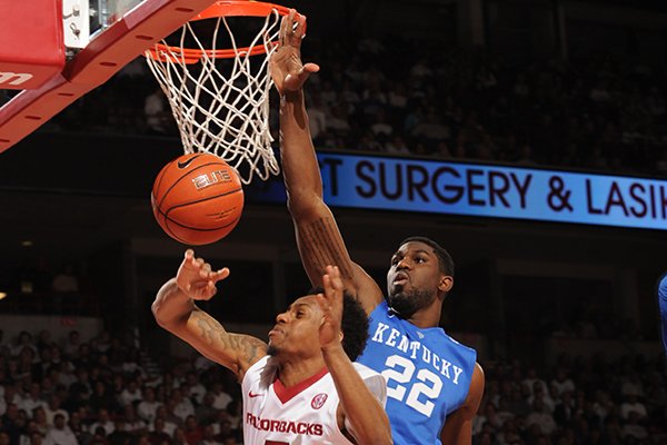 Anthlon Bell (5) of Arkansas takes a shot as Alex Poythress (22) of Kentucky Thursday, Jan. 21, 2016, during the second half of play in Bud Walton Arena in Fayetteville. 