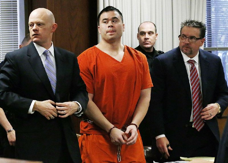 Daniel Holtzclaw stands with his attorneys, Robert Gray (left) and Scott Adams, during his sentencing Thursday in Oklahoma City. 