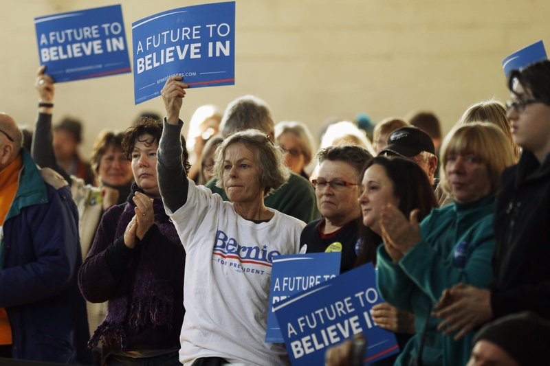 Attendees listen as Democratic presidential candidate, Sen. Bernie Sanders, I-Vt. speaks during a campaign stop, Thursday, Jan. 21, 2016, in Peterborough, N.H. 