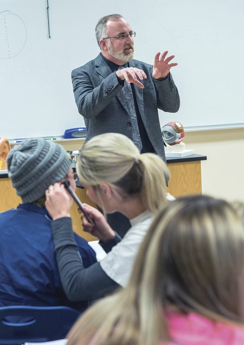 Vernon Hoffman talks to students in his anatomy and physiology 2 class as they check each other’s ears. Hoffman was recently selected as the 2015 Outstanding Faculty Member at the University of Arkansas Community College at Batesville, an honor that is given to one faculty member each year through a selection process that includes students and peers.