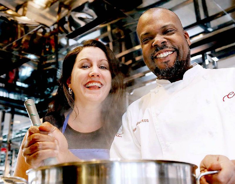 Soup Sunday chairman Hannah Vogler and VIP chef Tim Morton stir up some soup in the kitchen at Cache.